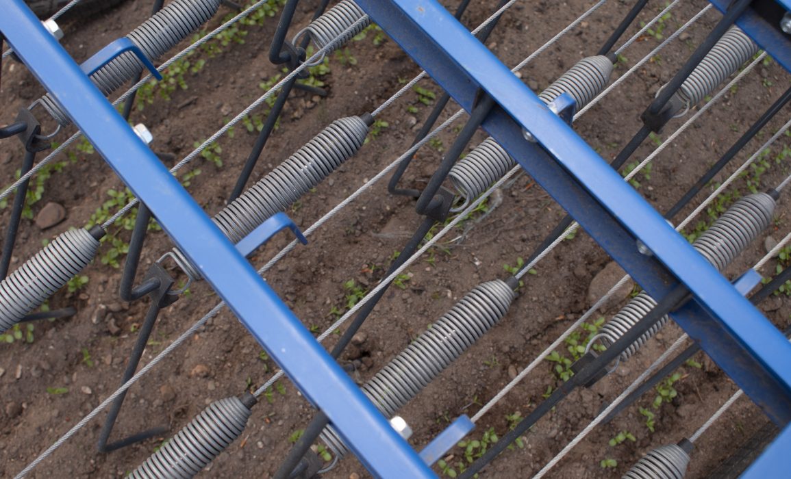 the individual treffler hooks rake between the flax rows