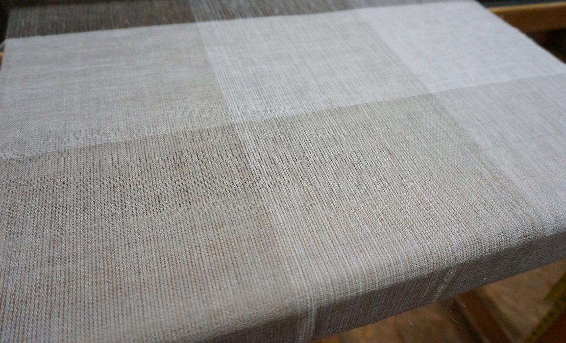 linen textile sampler in progress on the loom 