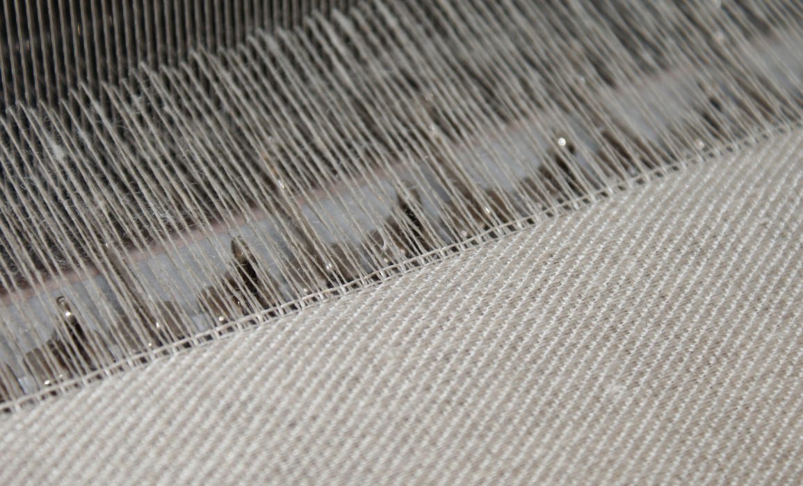 close-up of the warp (vertical) and weft (horizontal) threads in a twill sample